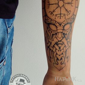Tattoo Viking on the forearm motif: black and gray style: graphic / illustrative