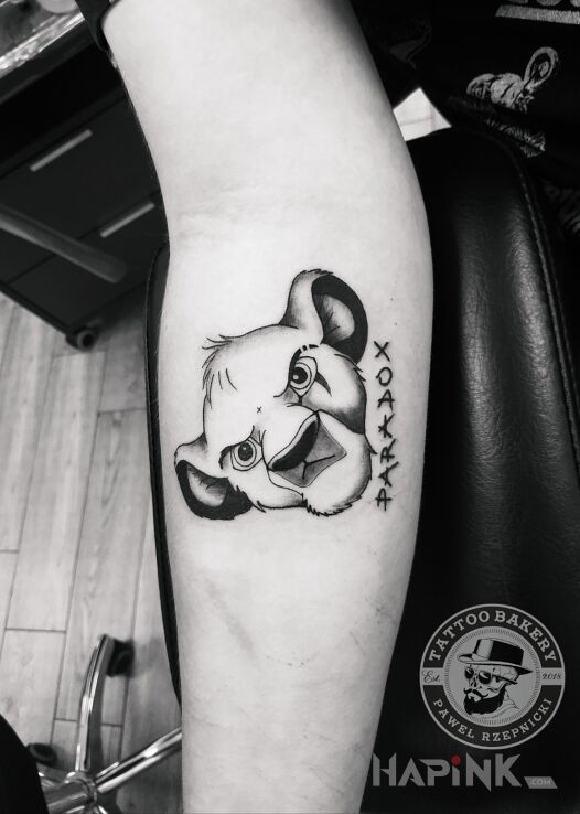 Tattoo Paradox in characters motif and graphic / illustrative style on the forearm