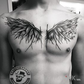 Tattoo Wings on the chest motif: black and gray style: sketch