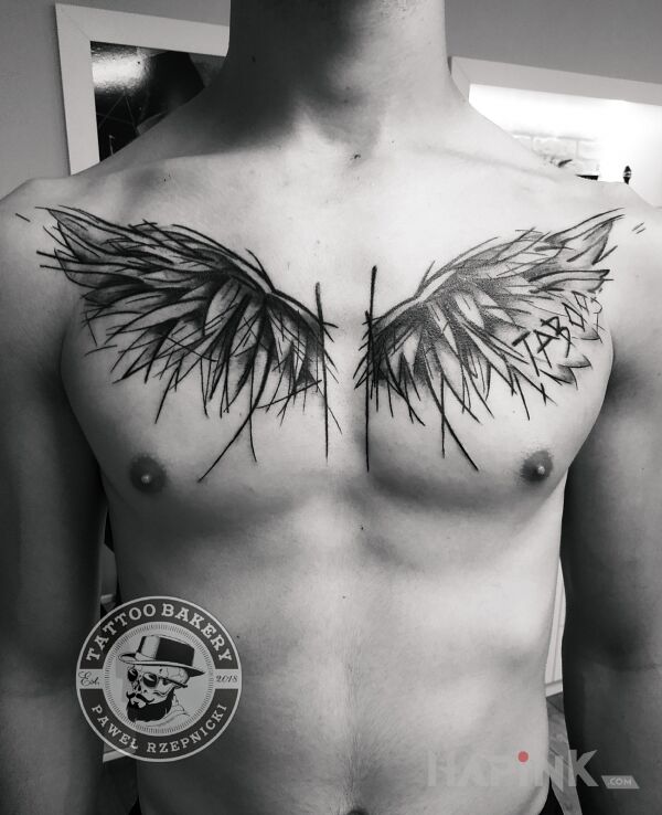 Tattoo Skrzydła in wings motif and sketch style on the chest
