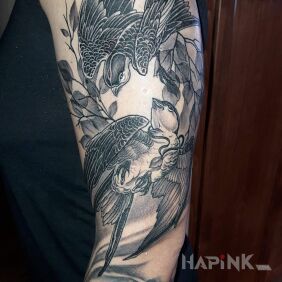 Tattoo Swallows on the upper arm motif: animals style: graphic / illustrative