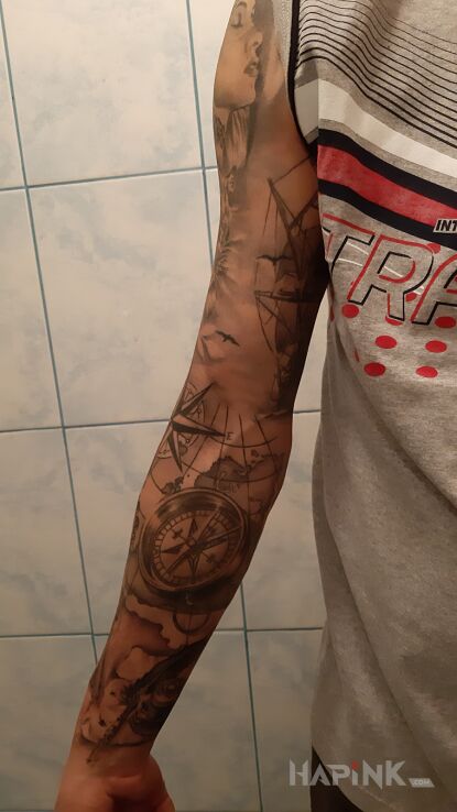 Tattoo Morskie podróże in black and gray motif and realistic style on the forearm