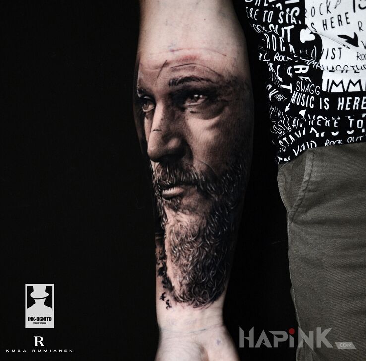 Tattoo Ragnar in characters motif and realistic style on the forearm