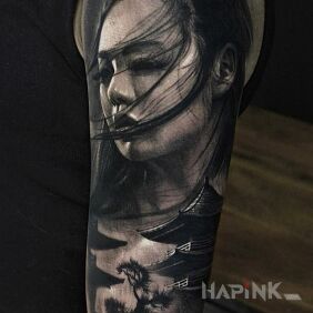 Tattoo Portrait of a Japanese Woman on the upper arm motif: black and gray style: realistic