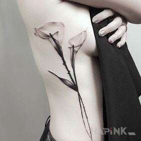 Tattoo Gentle flowers on the ribs motif: black and gray style: graphic / illustrative