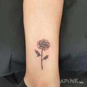 Tattoo Rose near the ankle motif: flowers style: graphic / illustrative