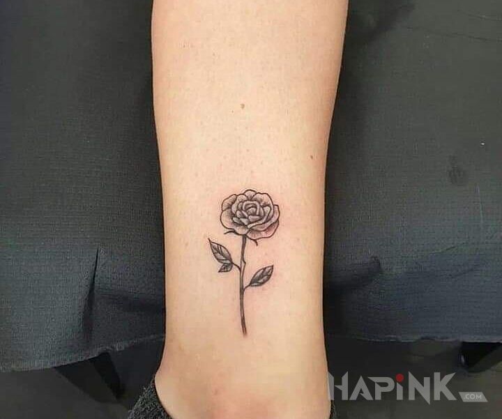 Tattoo Róża in flowers motif and graphic / illustrative style near the ankle