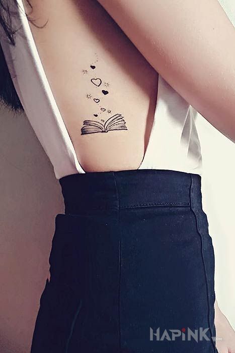 Tattoo Książka in black and gray motif and graphic / illustrative style on the ribs