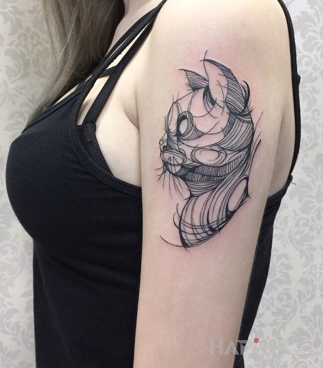 Tattoo Kot in animals motif on the upper arm