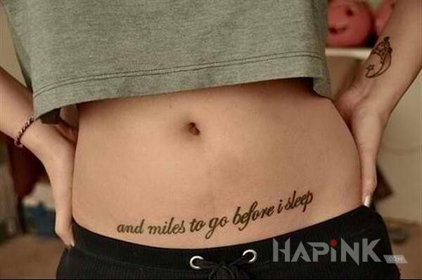 Tattoo And miles to go before i sleep in lettering motif on the stomach