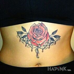Tattoo Rose on the stomach motif: flowers