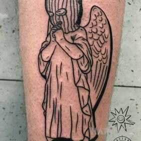 Tattoo Angel on the street. on the calf motif: angels style: contour / linework
