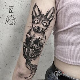 Tattoo Cute pet on the upper arm motif: animals style: sketch