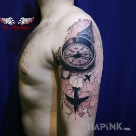 Tattoo A travel classic :-) on the upper arm motif: black and gray style: realistic