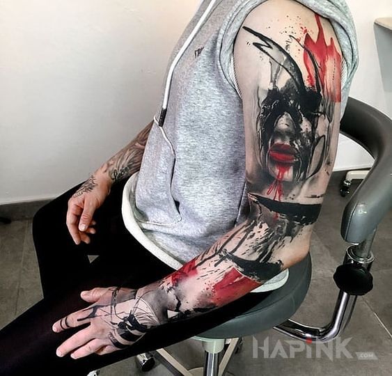 Tattoo Rękaw trash polka in faces motif and trash polka style on the hand