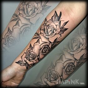 Tattoo Roses on the forearm motif: black and gray style: graphic / illustrative