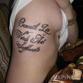 Tattoo Inscription on ribs on the ribs motif: lettering