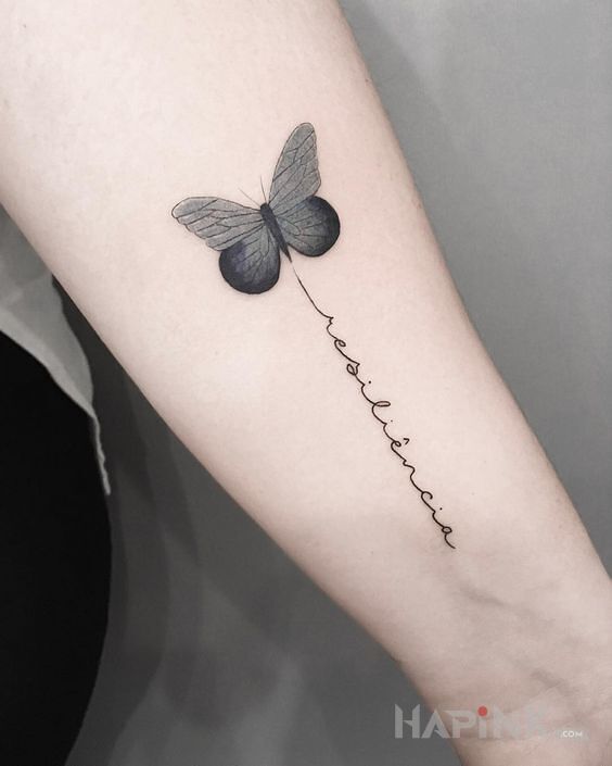 Tattoo Szary motyl in black and gray motif and graphic / illustrative style on the forearm