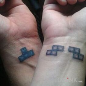 Tattoo Tetris blocks on the wrist motif: Love