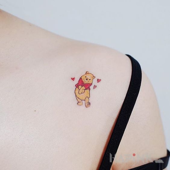 Tattoo Mały Kubuś in colorful motif and graphic / illustrative style on the collarbone