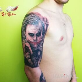 Tattoo Joker on the upper arm motif: characters style: realistic