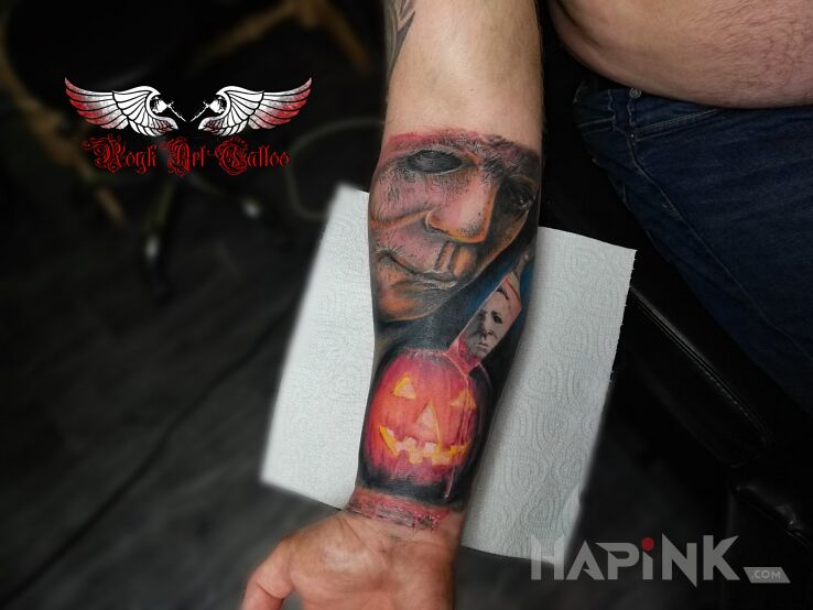 Tattoo Halloween in faces motif and realistic style on the forearm