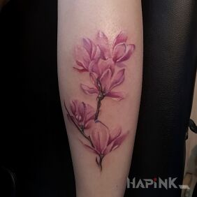 Tattoo Magnolia on the calf motif: colorful style: realistic