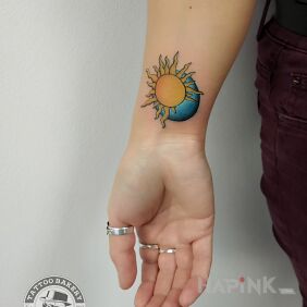Tattoo Sun moon on the forearm motif: colorful style: graphic / illustrative