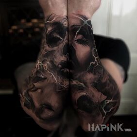 Tattoo Four faces on the forearm motif: characters