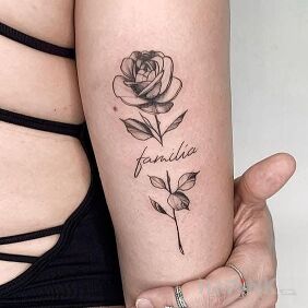 Tattoo Familia on the upper arm motif: flowers style: graphic / illustrative