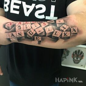 Tattoo Family on the forearm motif: lettering style: realistic