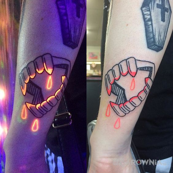 Tatuaż wampirze kły w motywie pozostałe i stylu graficzne / ilustracyjne na przedramieniu