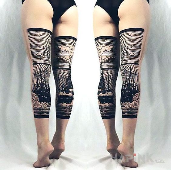 Tattoo Statek i fale in black and gray motif and engravings / gravure style on the leg