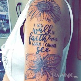 Tattoo Faith on the upper arm motif: lettering style: graphic / illustrative
