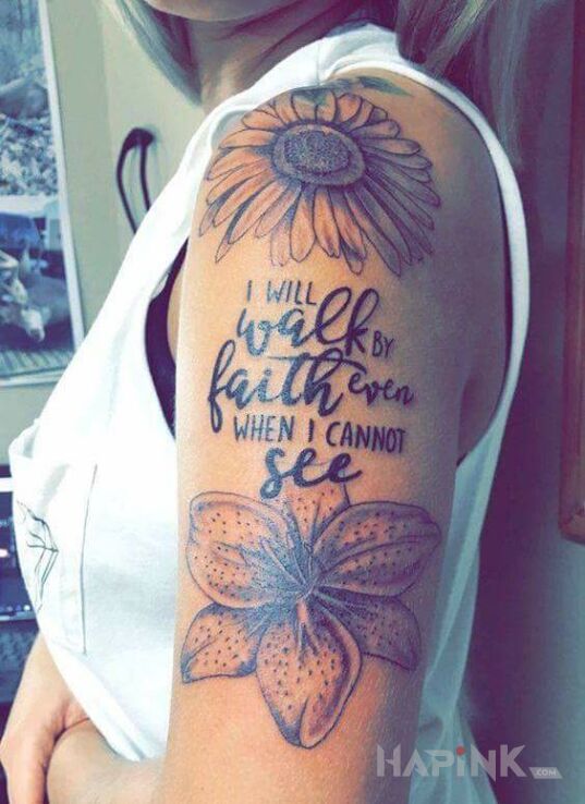 Tattoo Wiara in lettering motif and calligraphy style on the upper arm
