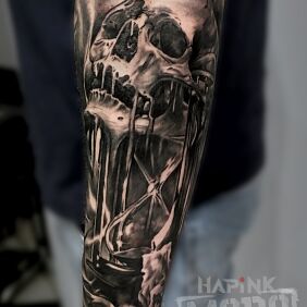 Tattoo Hourglass/skull on the forearm motif: black and gray style: realistic