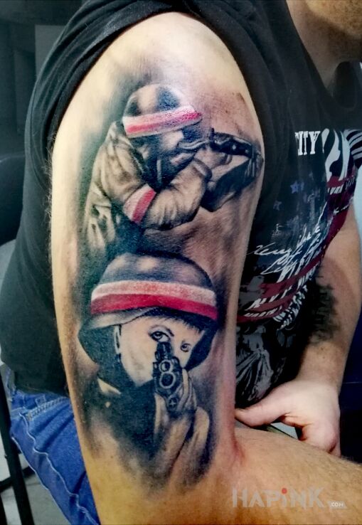 Tattoo Powstaniec in war motif and realistic style on the upper arm