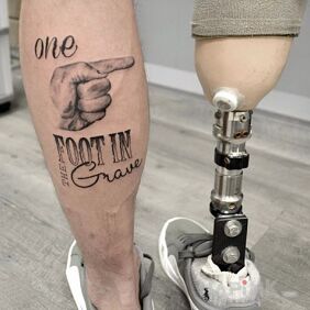 Tattoo With distance on the calf motif: lettering style: calligraphy