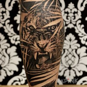 Tattoo Tiger on calf on the calf motif: animals style: realistic