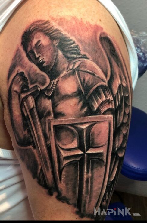 Tattoo Archanioł in black and gray motif and realistic style on the upper arm