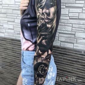 Tattoo Lady with a cigarette on the upper arm motif: sleeves style: realistic