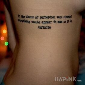 Tattoo Caption in English on the ribs motif: lettering