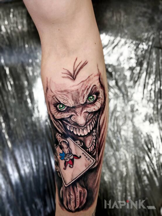 Tattoo Joker in characters motif and graphic / illustrative style on the forearm