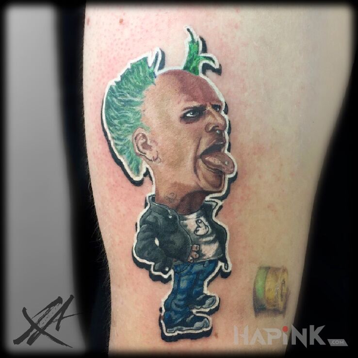 Tattoo Keith Flint in colorful motif and realistic style on the calf