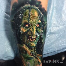 Tattoo Gremlin or troll on the forearm motif: characters