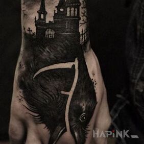 Tattoo Raven scythe on the wrist motif: black and gray style: blackwork / blackout