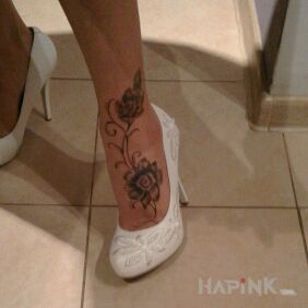 Tattoo Flower foot on the calf motif: flowers