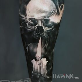 Tattoo Skull with candle on the forearm motif: dark style: realistic