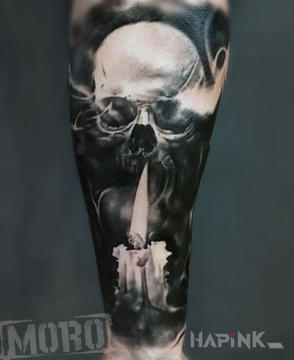 Tattoo Czaszka ze świecą in black and gray motif and realistic style on the forearm