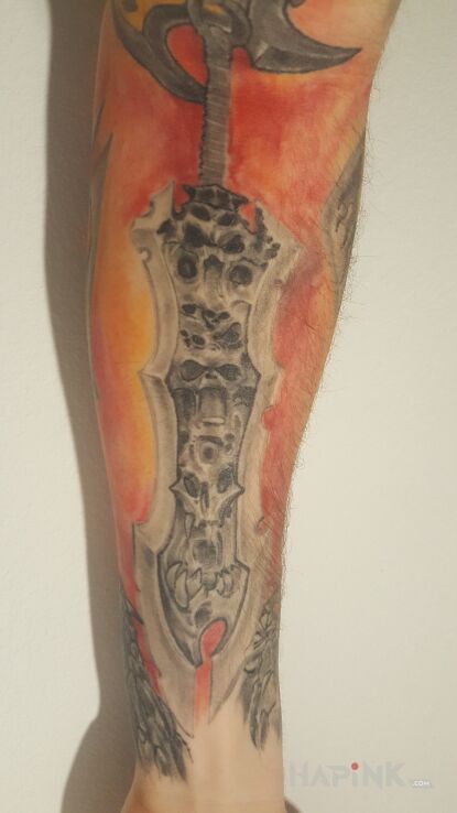 Tattoo Miecz chaosu in colorful motif and graphic / illustrative style on the forearm